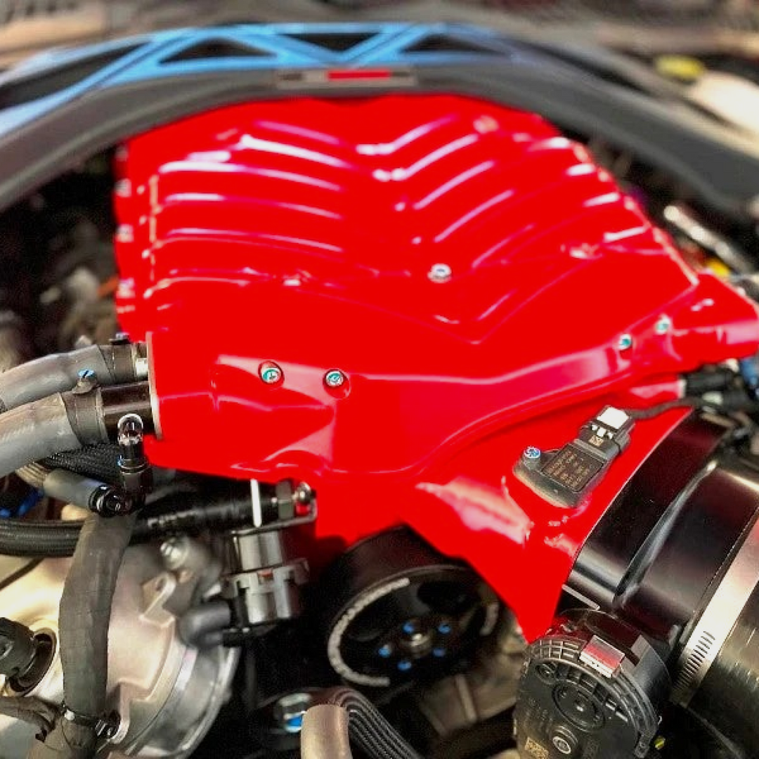 Whipple Superchargers Shelby GT500 supercharger system for 2020-2022 Mustang, with polished aluminum components and black hoses.