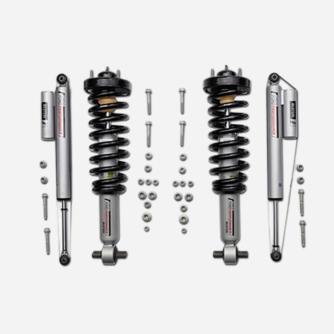Ford Performance F-150 off-road suspension lowering kit installed on a 2021-2026 model, showcasing the upgraded suspension components.
