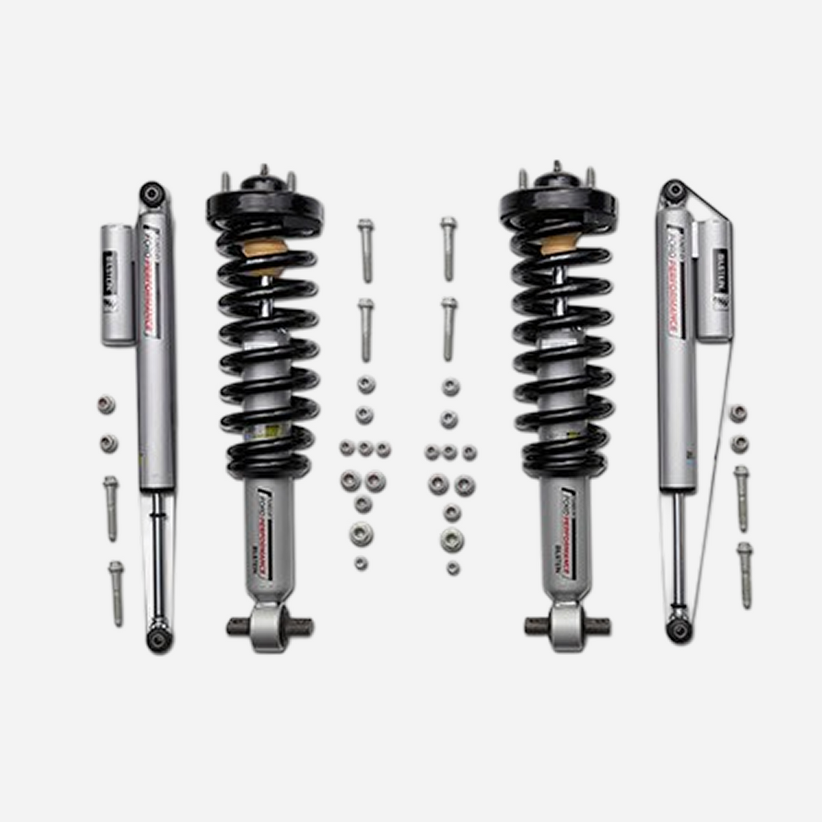 Ford Performance F-150 off-road suspension lowering kit installed on a 2021-2026 model, showcasing the upgraded suspension components.