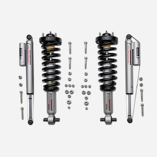 Ford Performance F-150 off-road suspension lowering kit installed on a 2021-2026 model, showcasing the upgraded suspension components.