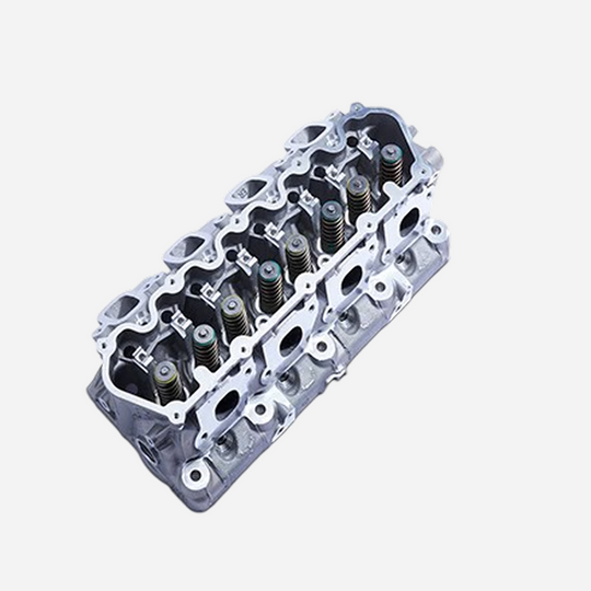 Assembled 7.3L Godzilla RH cylinder head by Ford Performance, showing detailed engine component with bolt holes and valve seats.