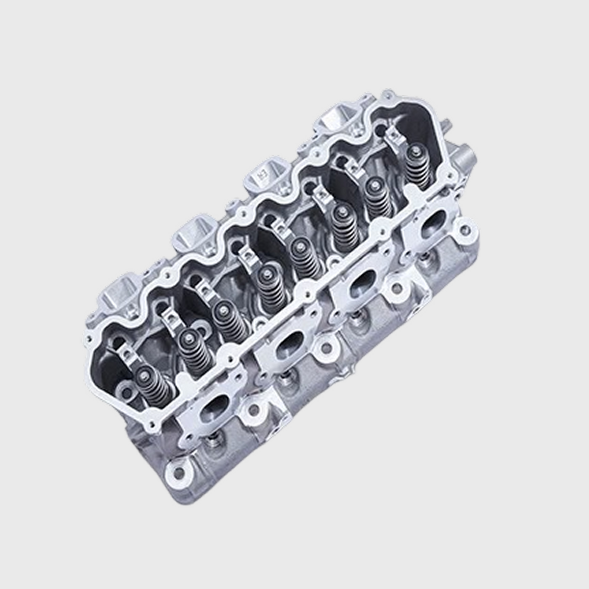 Ford Performance 7.3L CNC ported cylinder head for high-performance engine upgrades, showing polished metal finish and port design.