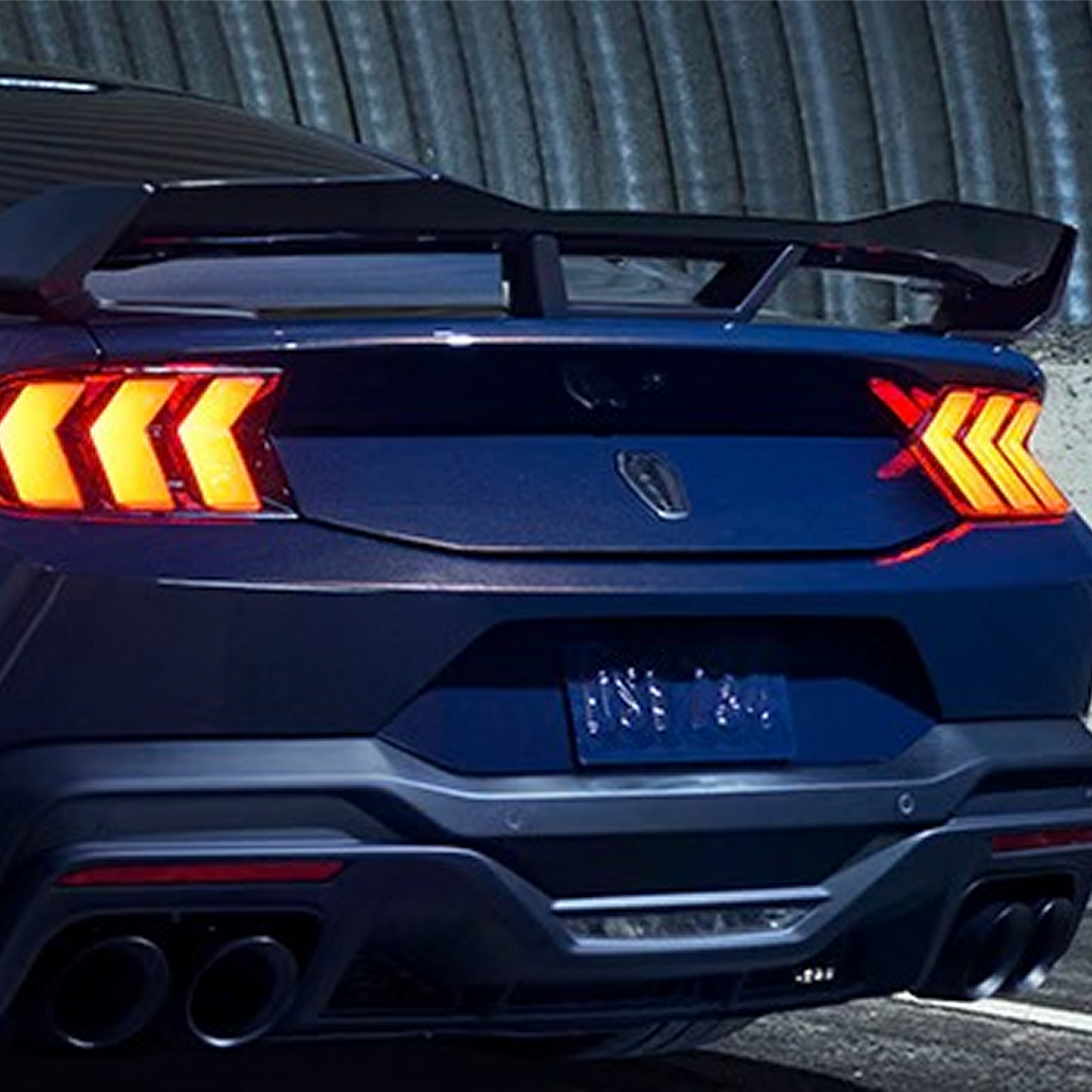 Ford Performance 2024-2025 Mustang rear spoiler with Gurney flap, showcasing aerodynamic design and high-quality construction.