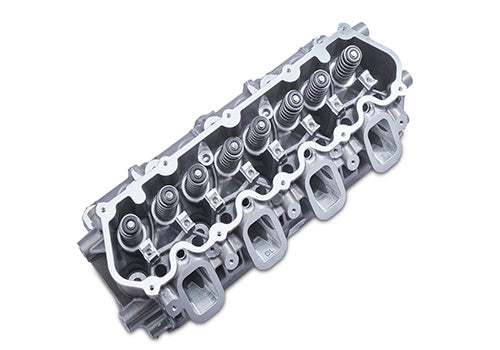 Paul's Automotive Engineering 7.3L LH CNC ported cylinder head with detailed machined surfaces and valve openings.
