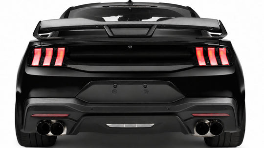 Ford Performance Mustang Stallion 2024-27 white tail lights showing black V-shaped rear design on the vehicle.